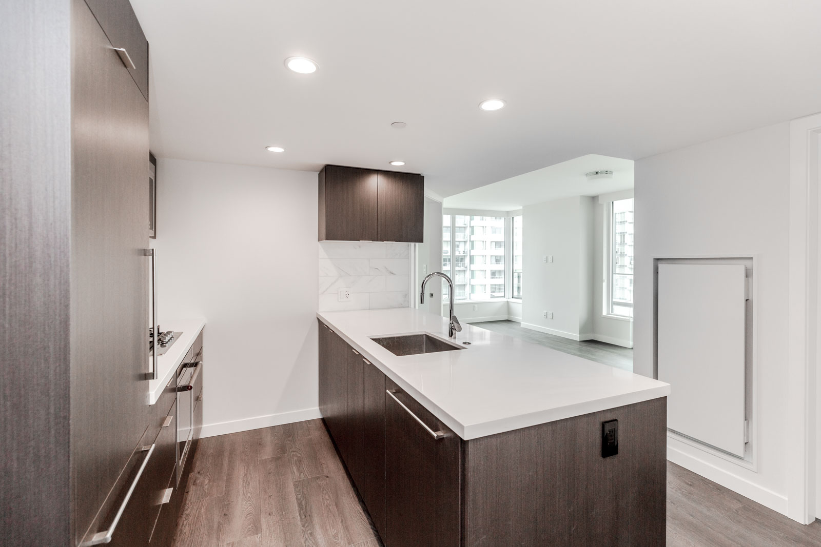 Downtown Vancouver luxury rental condo kitchen with stainless steel appliances.