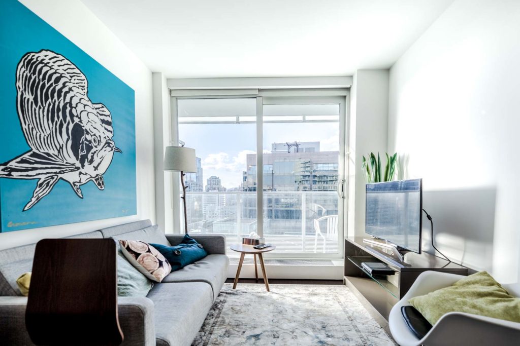 Furnished living room with view at Downtown Vancouver condo rental.
