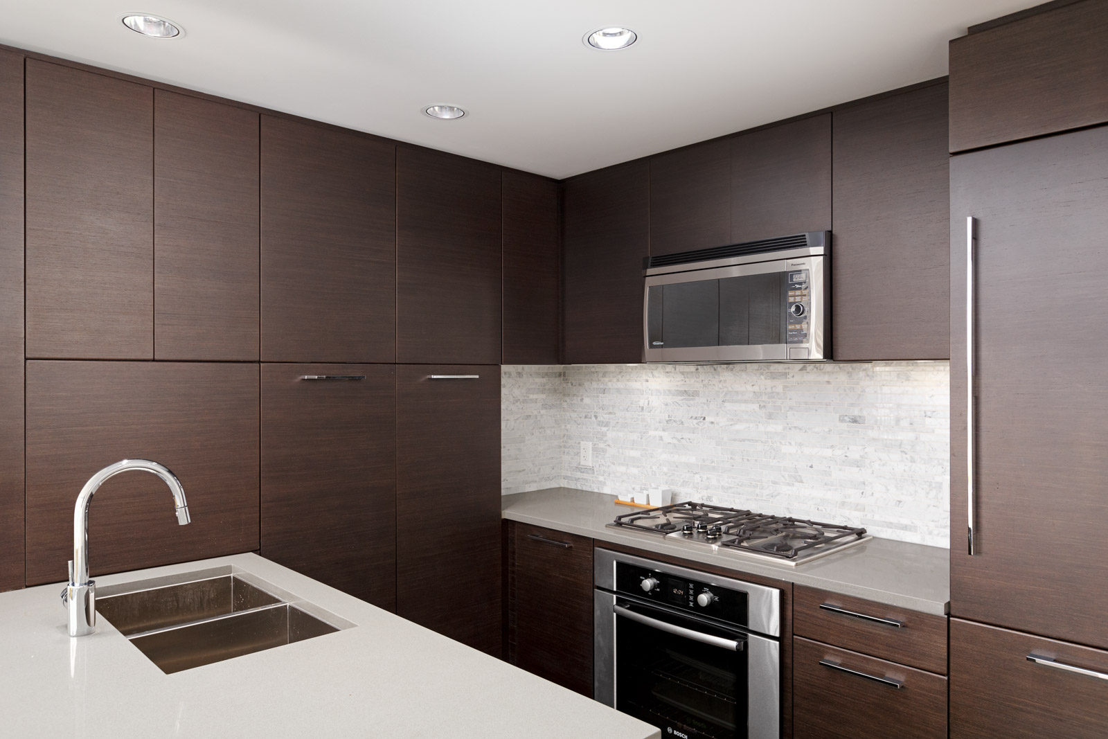 Kitchen with stainless steel appliances in UBC rental condo.