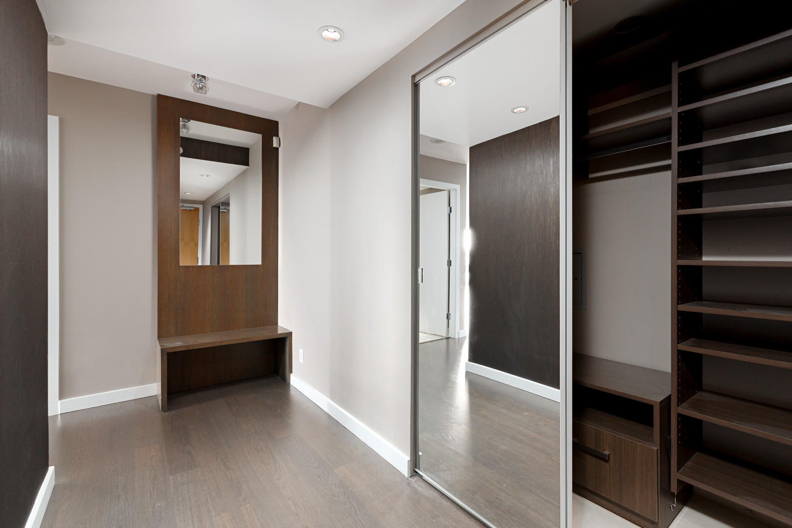 Bedroom with sliding door closet inside luxury Vancouver rental.