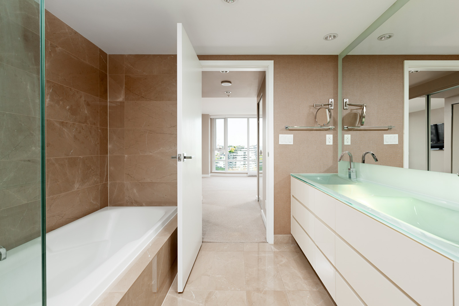 Bathroom with built-in tub inside luxury Vancouver rental condo.