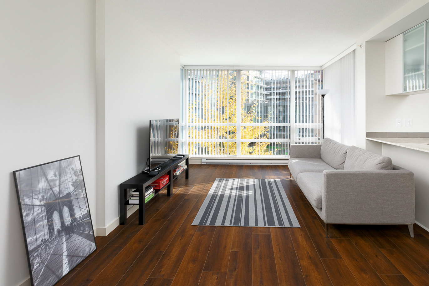 living room in richmond condo with wooden floors and bright view