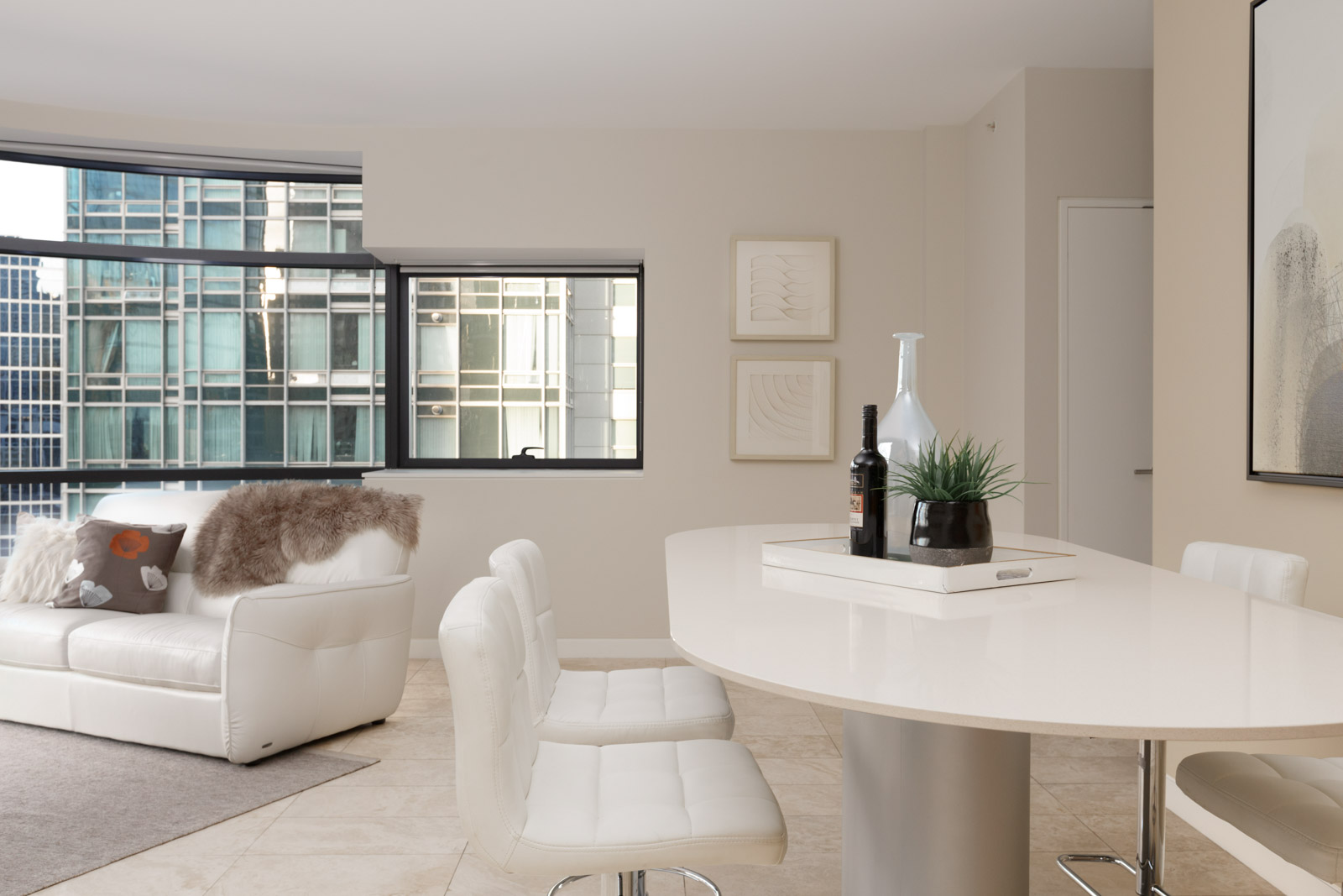 white table and chairs in living room of jameson house condo