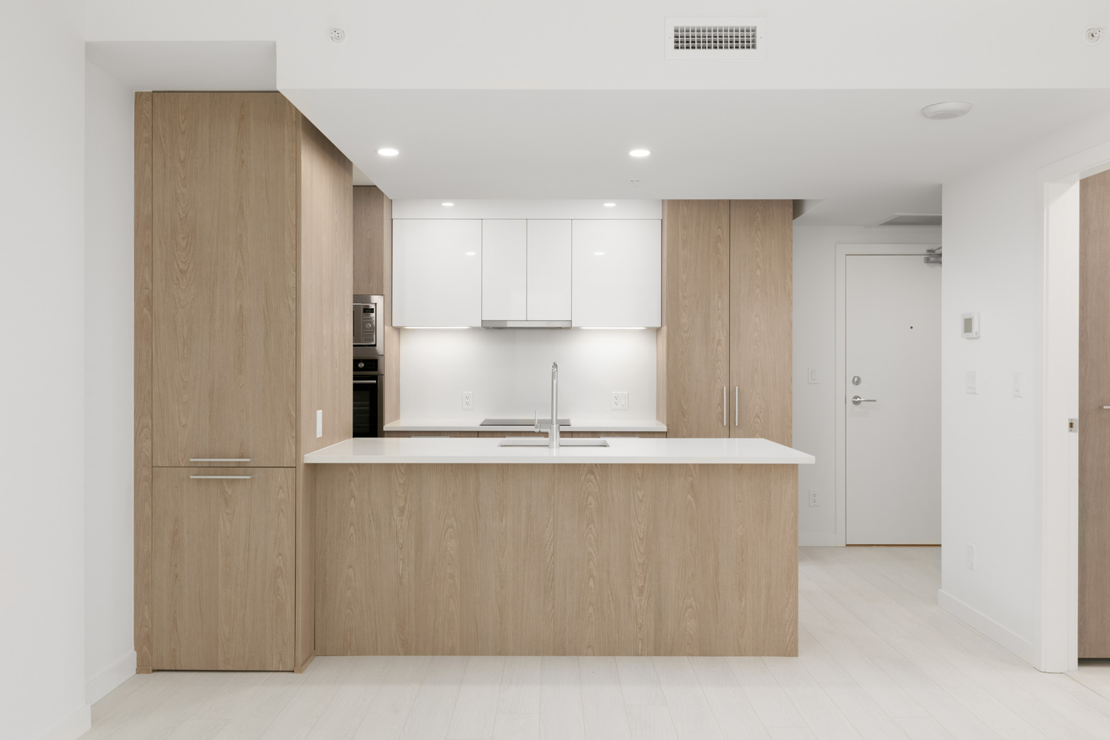 kitchen of empty new rental condo at the independent in mount pleasant vancouver managed by birds nest properties