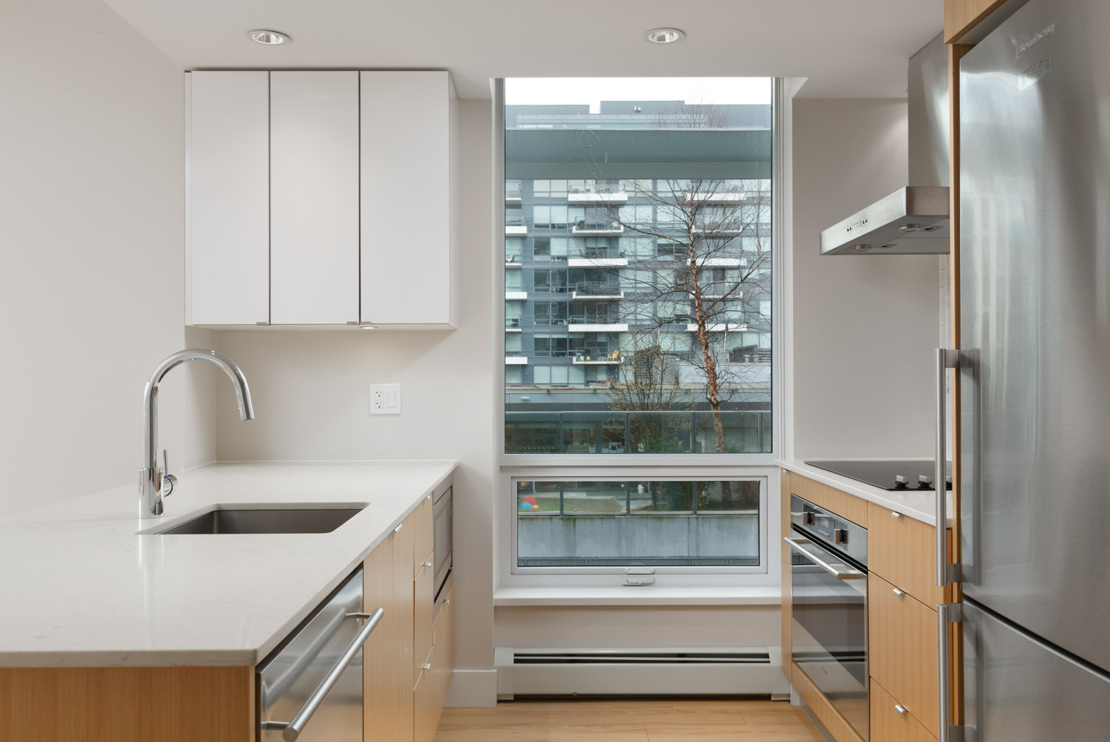 kitchen of rental condo at tower green in false creek olympic village vancouver managed by birds nest properties