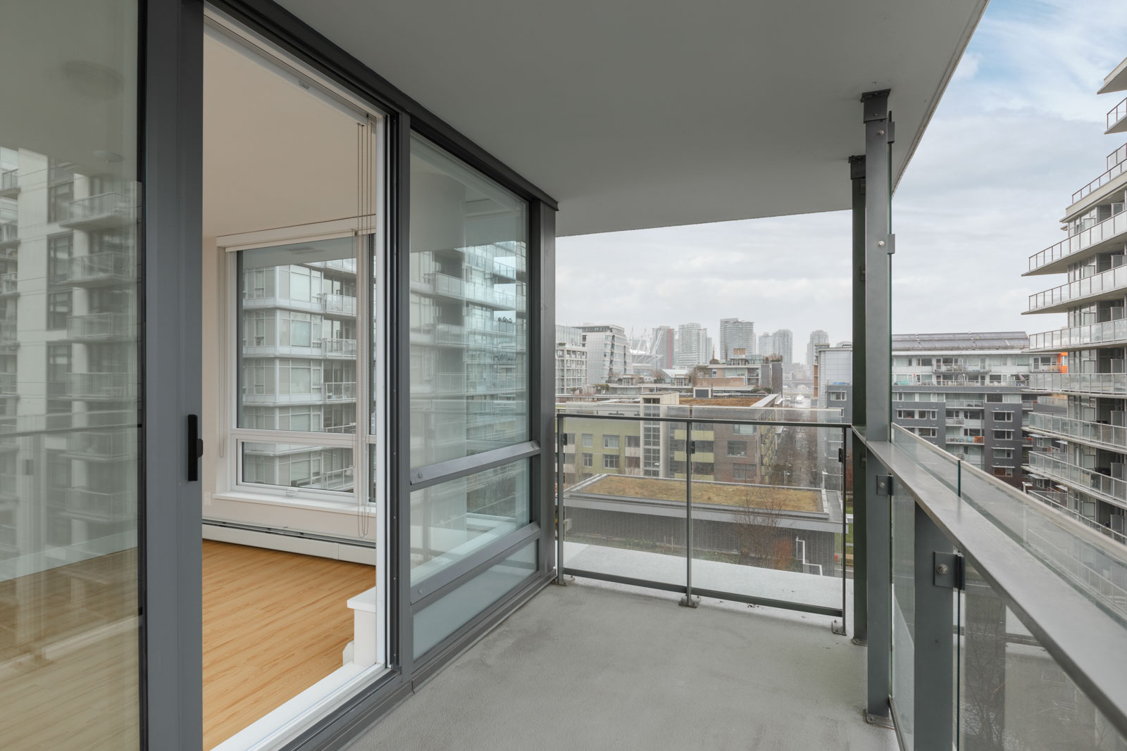 balcony of rental condo at tower green in false creek olympic village vancouver managed by birds nest properties