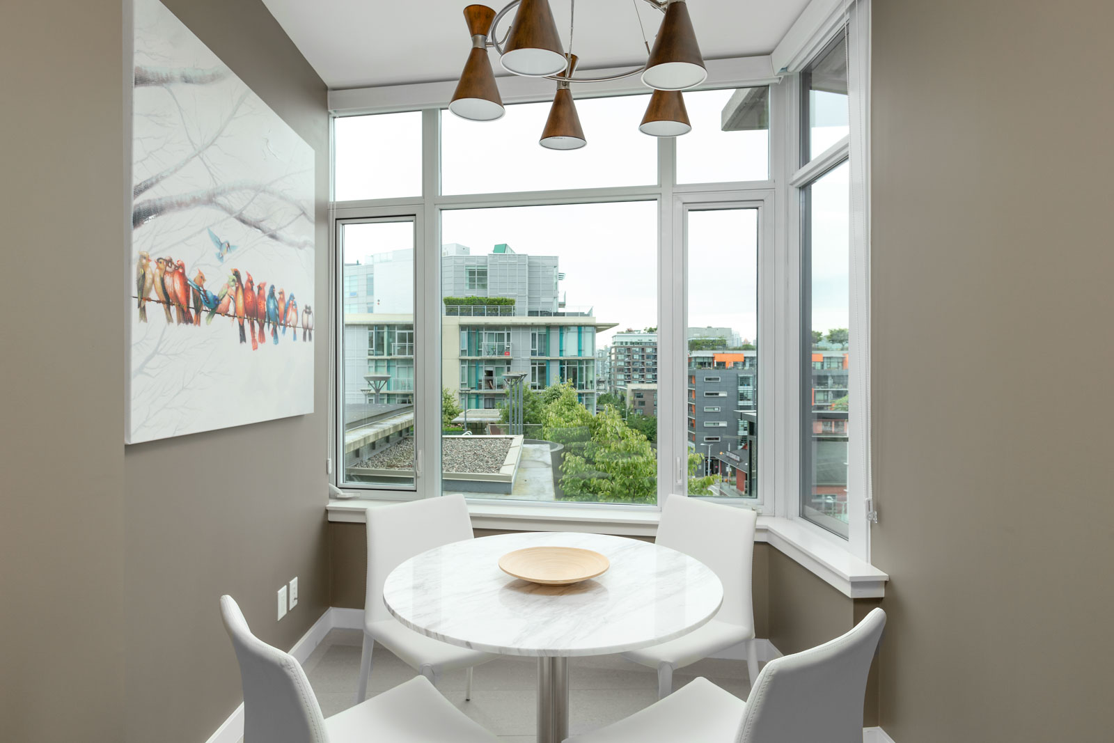 den with white walls and hardwood floors and floor to ceiling windows in rental condo in Vancouver