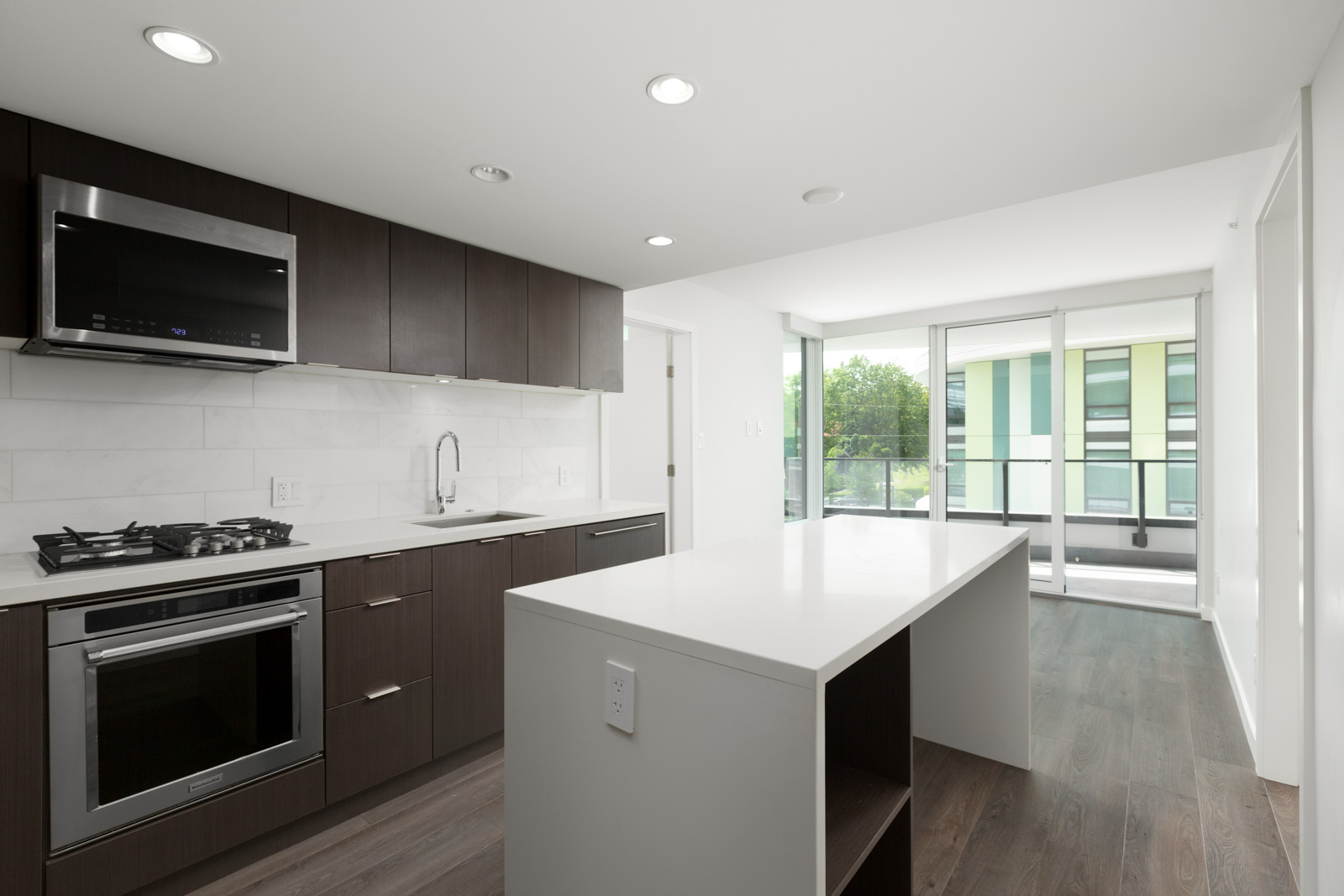 rental condo kitchen and living room at northwest building in cambie and marine gateway neighbourhood of vancouver westside managed by birds nest properties