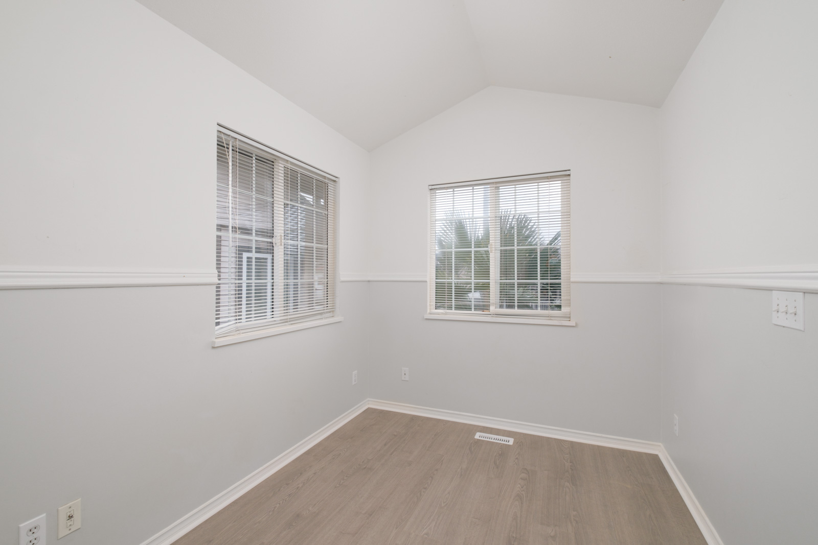 room with white walls and two windows in rental house in east vancouver managed by birds nest properties