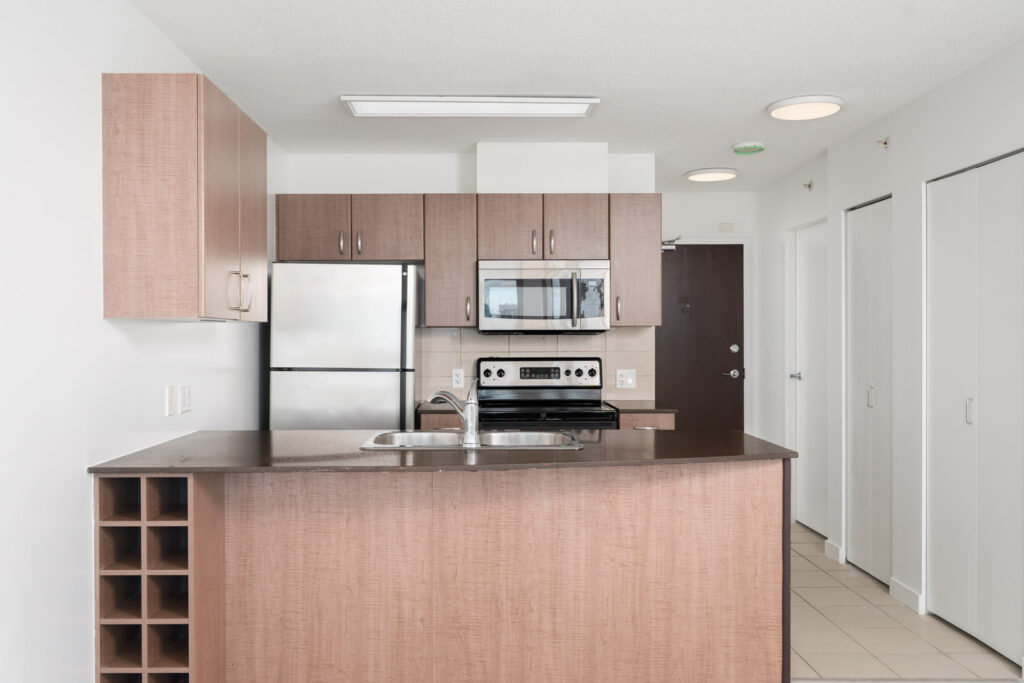 Fully equipped kitchen in a condo managed by Birds Nest Properties
