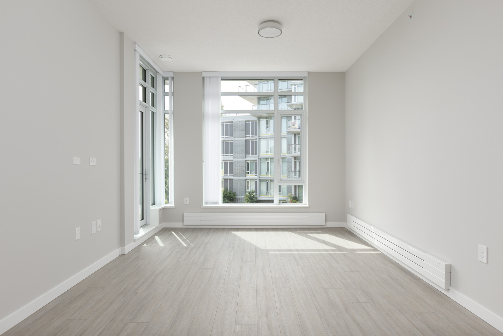 bedroom with white walls and window in rental condo in the Downtown neighbourhood of Vancouver