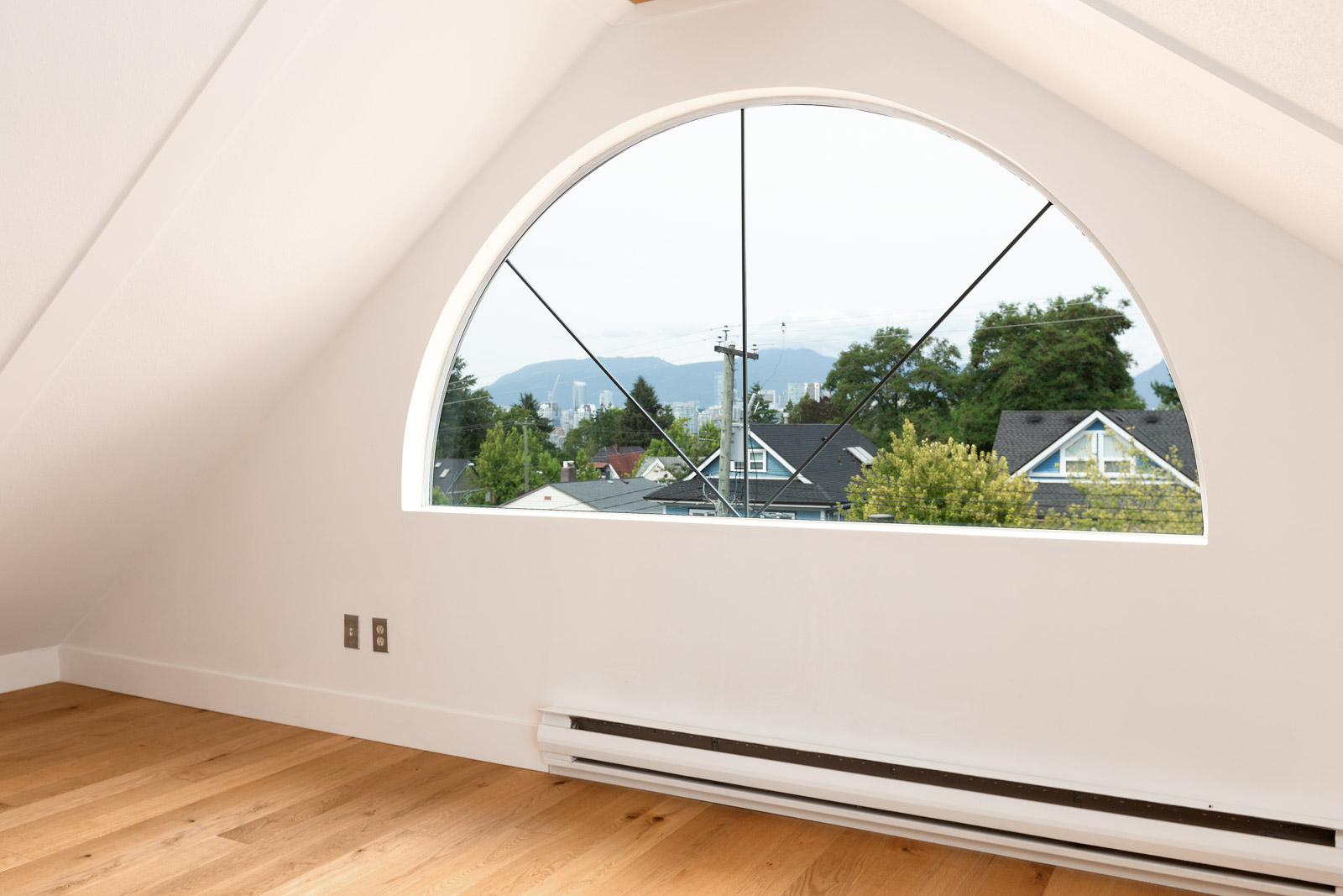 beautiful architectural roofing with window overlooking vancouver lanscape