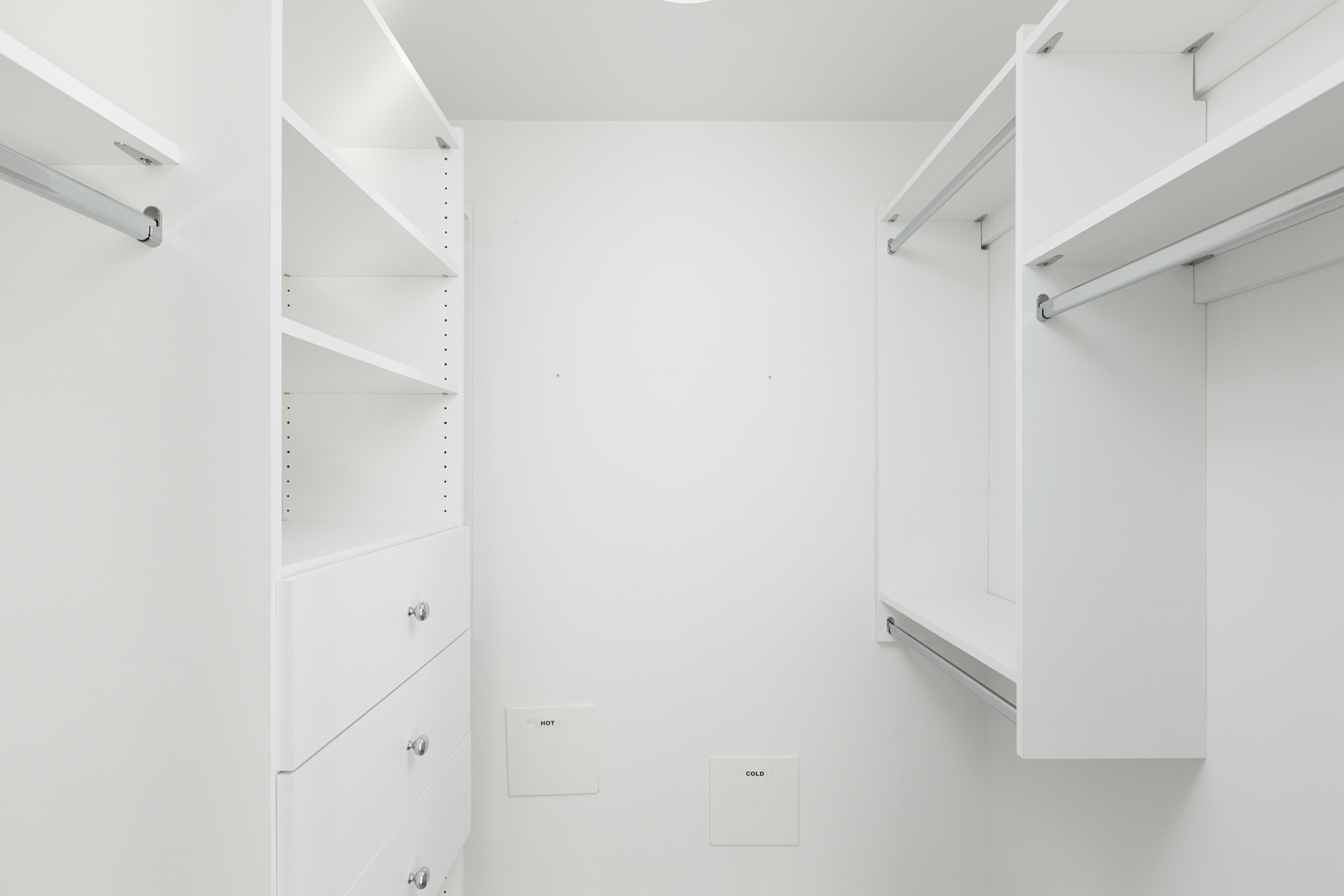large walk-in closet in Mount Pleasant condo with white walls