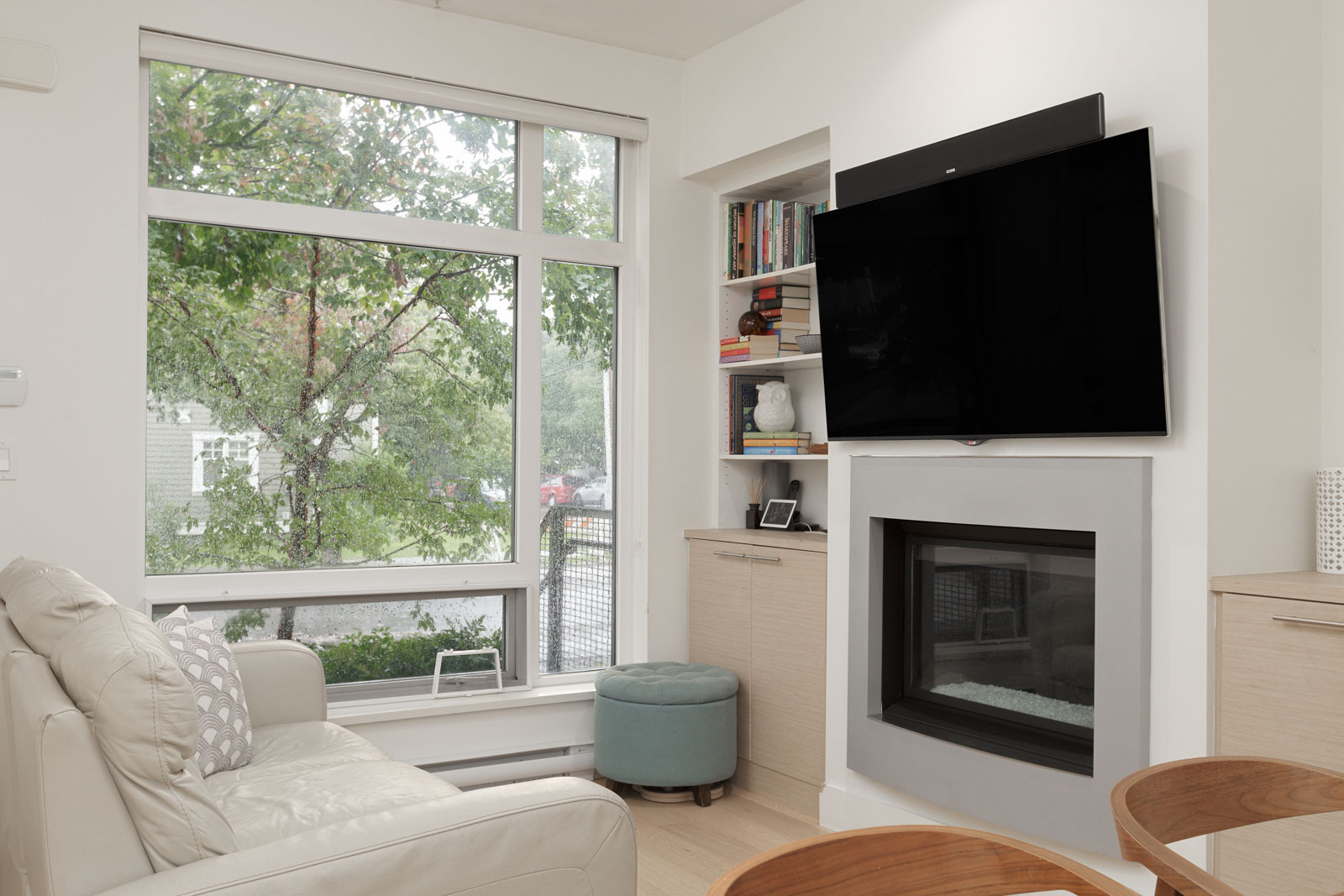 tv and fireplace in townhouse located in east vancouver