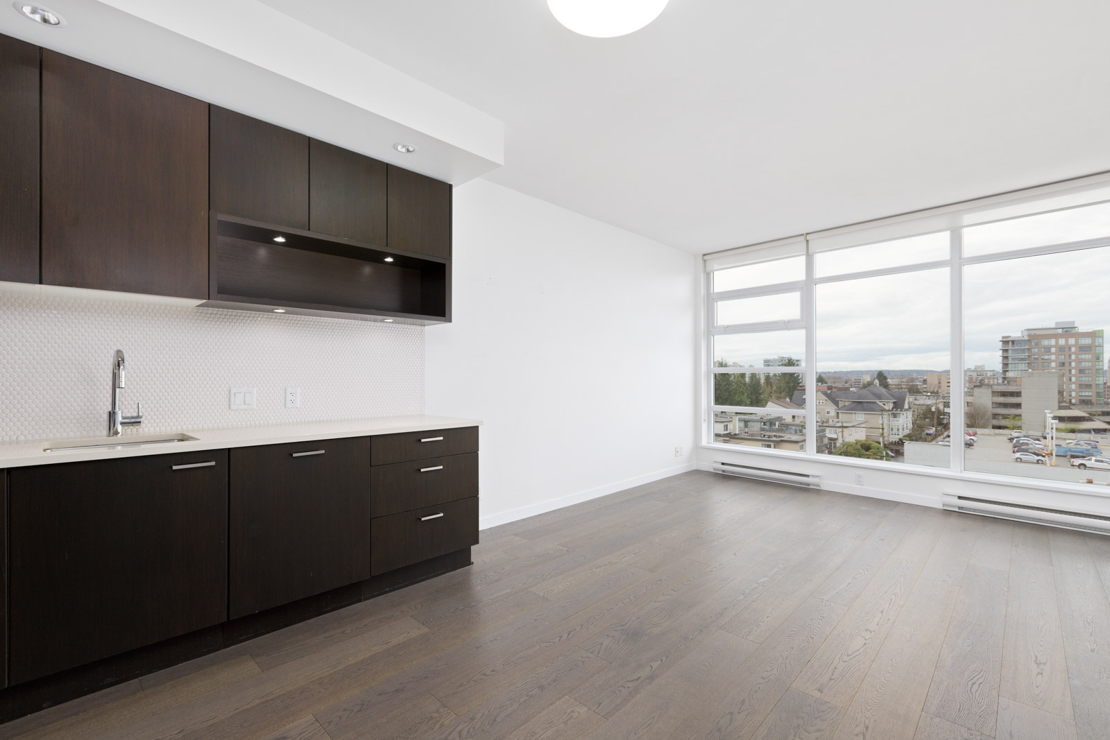 kitchen and living room in upscale condo in Vancouver's Fairview neighbourhood