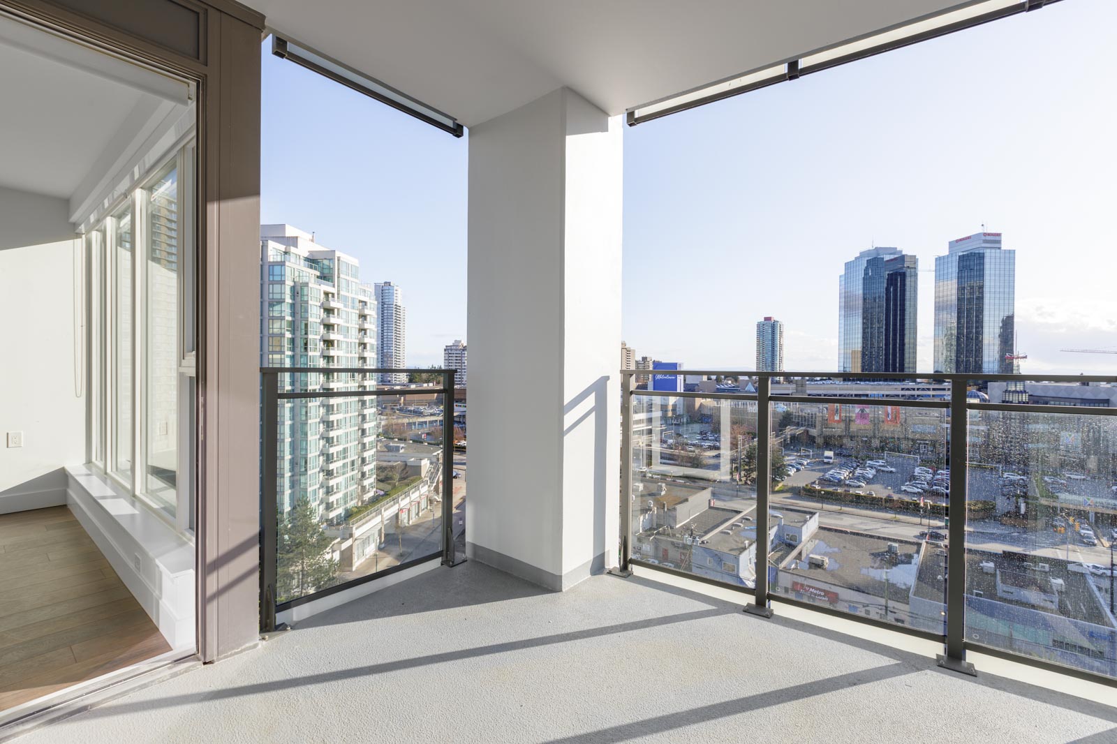 larger corner balcony with view of burnaby and metrotown mall