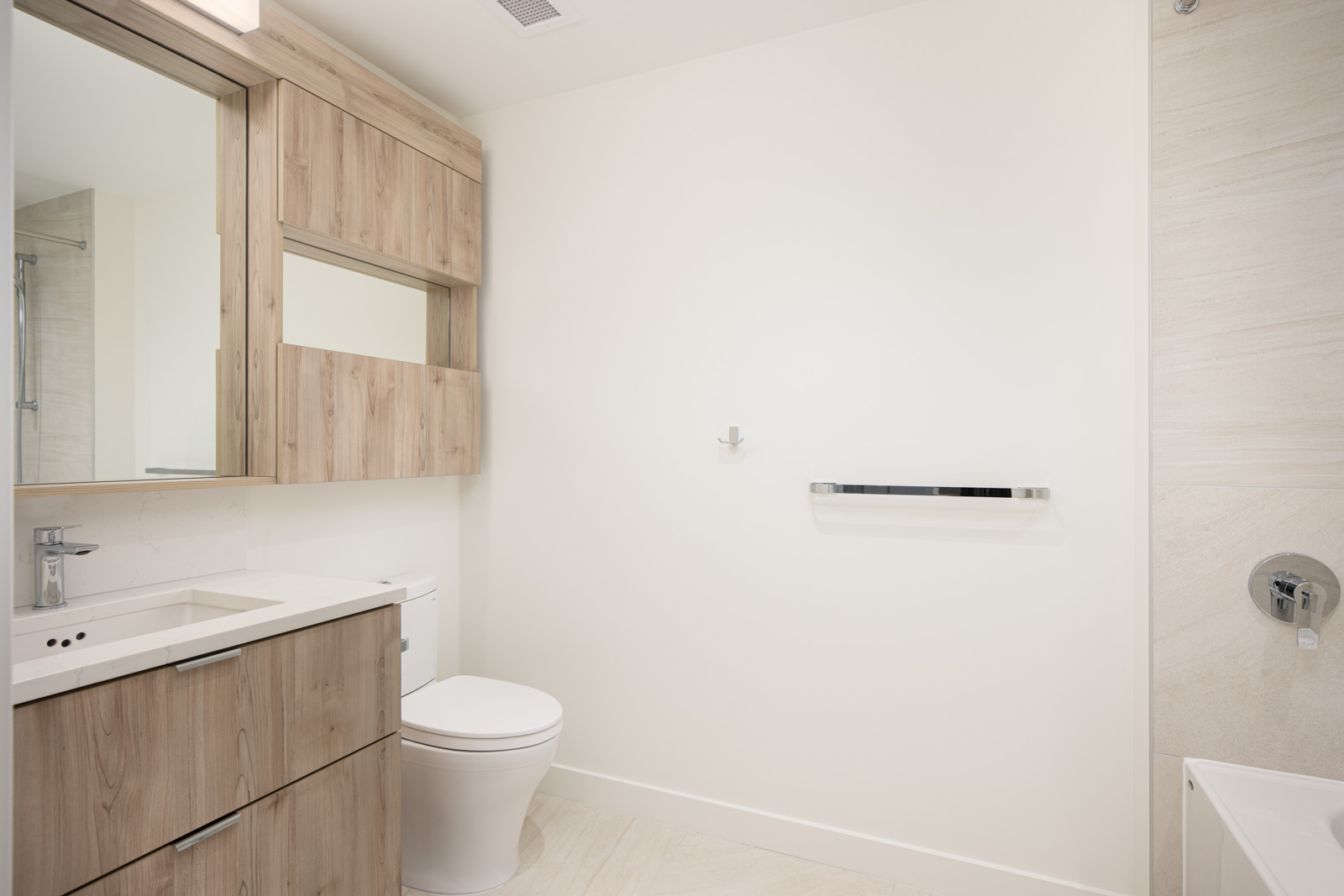 A bathroom with a toilet and sink.